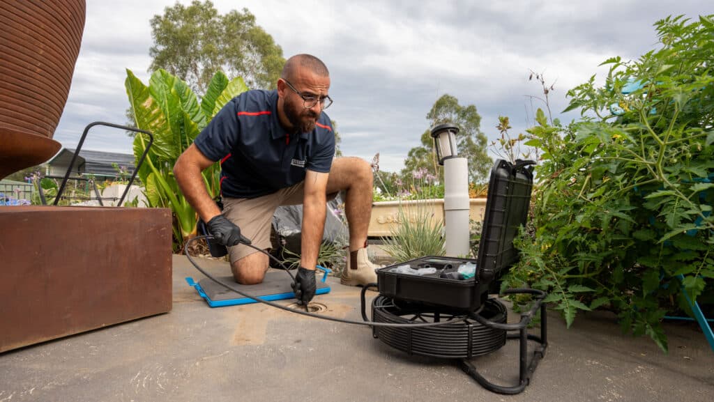 Professional drain-cleaning equipment used to clear a blocked toilet