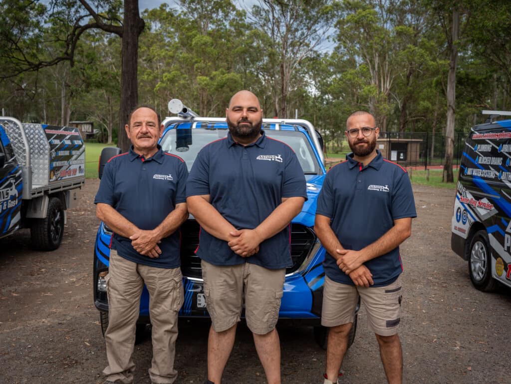 Licensed plumber carrying out compliant drain-clearing work