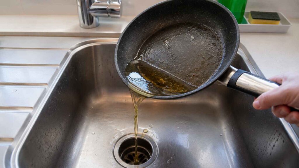 Pouring Oil in Sink Drain
