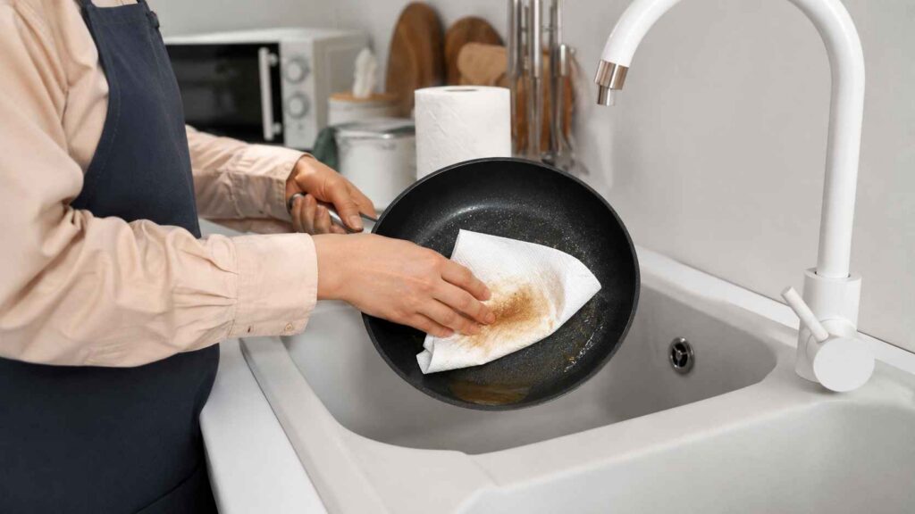 Wipe pans with paper towel before washing to remove residual fat